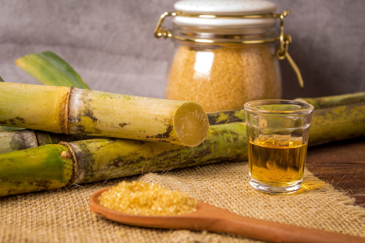 Extracting sugar cane juice with old traditional machine